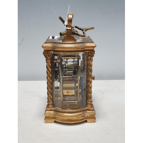 286 - A brass cased Carriage Clock with folding carrying handle above the white enamel rectangular dial ma... 