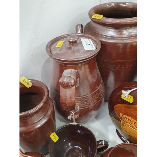 312 - A quantity of brown glaze pottery and stone ware, including hunting Jugs, Coffee Pot, cylindrical Ja... 