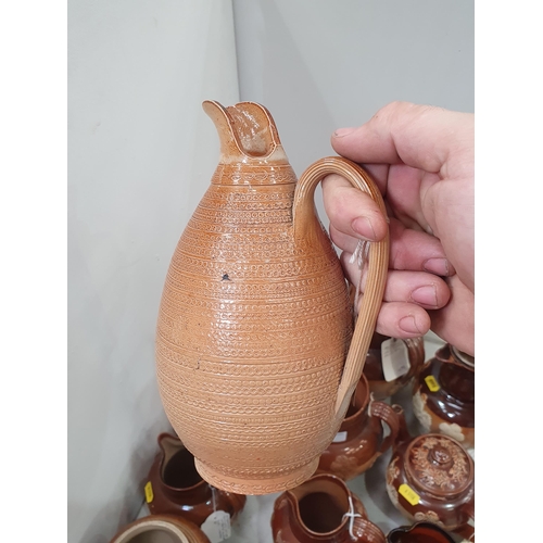 315 - A collection of salt glazed Jugs including Doulton Lambeth Hunting Jugs, similar Teapot, a Jug with ... 