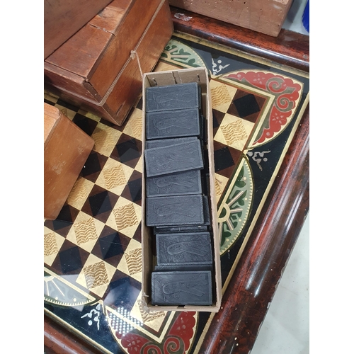 325 - A quantity of Chess Sets, Domino Sets and a framed glass Chess Board. (R5)