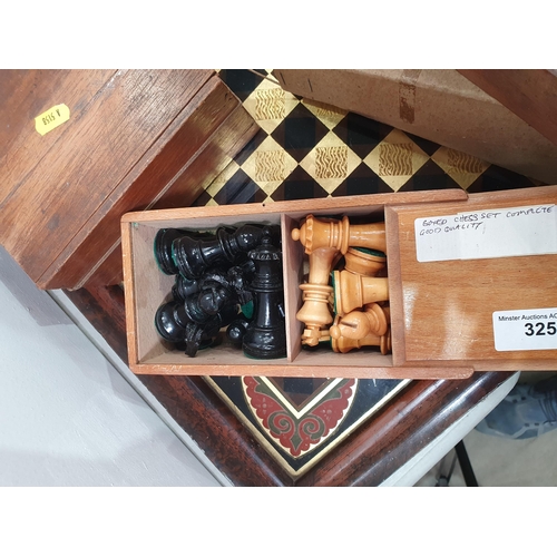 325 - A quantity of Chess Sets, Domino Sets and a framed glass Chess Board. (R5)