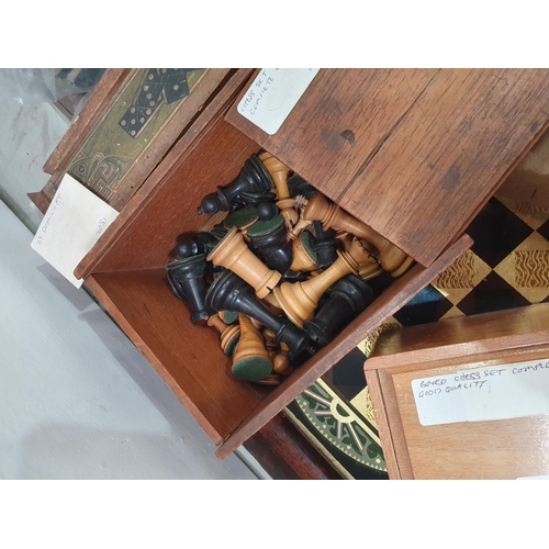 325 - A quantity of Chess Sets, Domino Sets and a framed glass Chess Board. (R5)