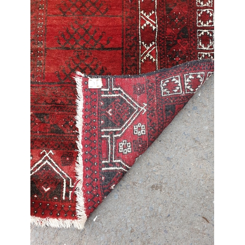 36 - An Afghan Rug 8ft 11in x 5ft 10in (R3)