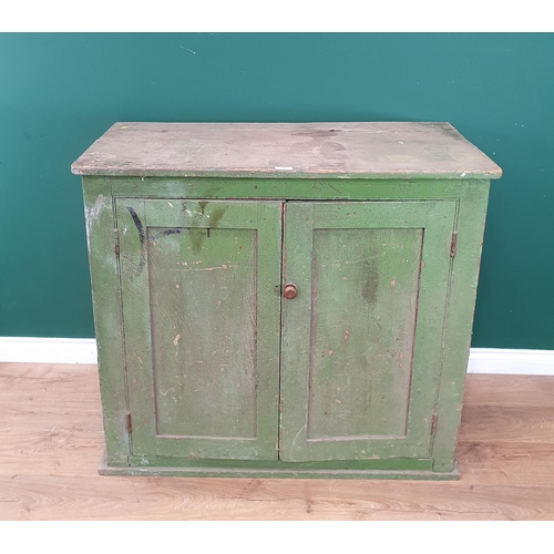 39 - A rustic green painted pine two door Cupboard, 3ft 3