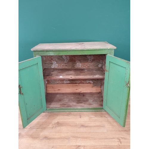 39 - A rustic green painted pine two door Cupboard, 3ft 3