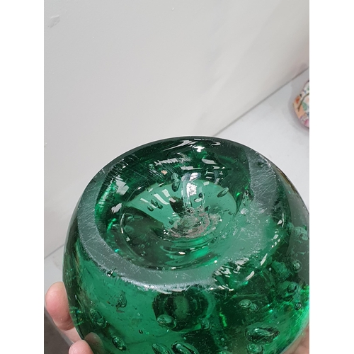 395 - A green glass Dump Weight with bubble inclusions, 4in H and a green glass Float