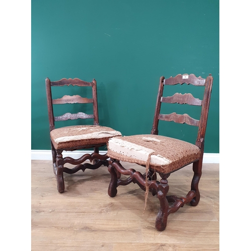 40 - A near pair of Antique continental Ladderback Chairs with stuff-over seats, on shaped supports and s... 