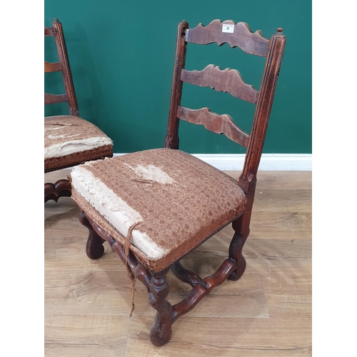 40 - A near pair of Antique continental Ladderback Chairs with stuff-over seats, on shaped supports and s... 