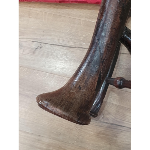 46 - A Georgian walnut corner Elbow Chair with red drop in seat mounted upon cabriole supports and pad fe... 