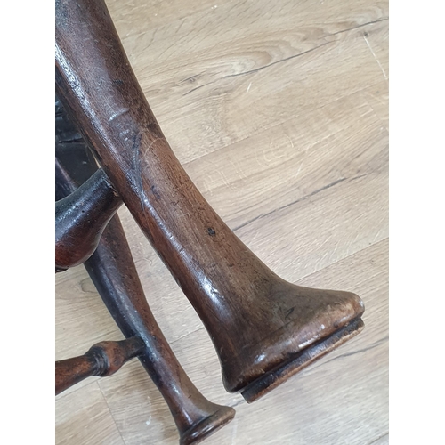 46 - A Georgian walnut corner Elbow Chair with red drop in seat mounted upon cabriole supports and pad fe... 