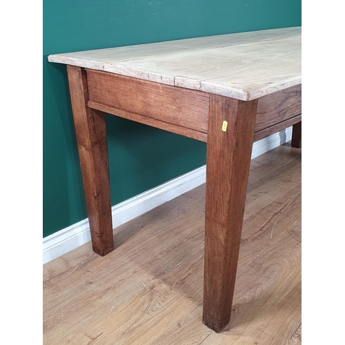 48 - An oak Dining Table with light oak plank top, raised on square tapered supports, 2ft 7