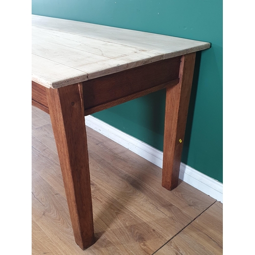 48 - An oak Dining Table with light oak plank top, raised on square tapered supports, 2ft 7