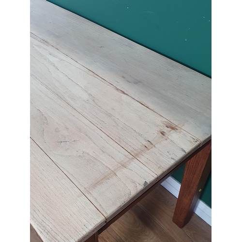 48 - An oak Dining Table with light oak plank top, raised on square tapered supports, 2ft 7