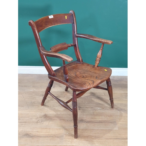 480 - An oak and elm Country Elbow Chair on turned supports and stretchers. (R3).