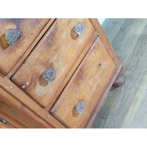 488 - A Victorian pine Dresser Base fitted seven drawers and single cupboard, raised on turned bun feet, 2... 