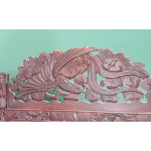 497 - A carved wooden dressing screen decorated with birds