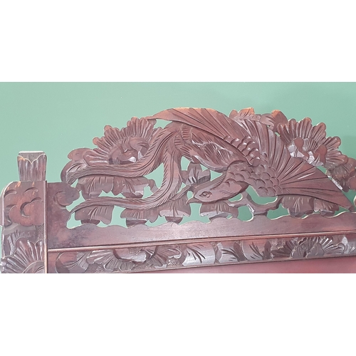 497 - A carved wooden dressing screen decorated with birds