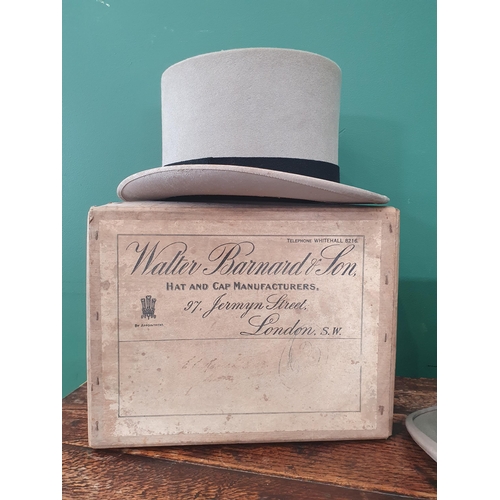 5 - A Vintage Grey Top Hat by Harrod's, and a boxed Grey Top Hat by Walter Barnard & Sons, A/F. (R2).