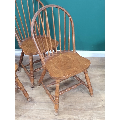 501 - A set of Four modern oak Stick back Kitchen Chairs on turned supports and stretchers. (R4).