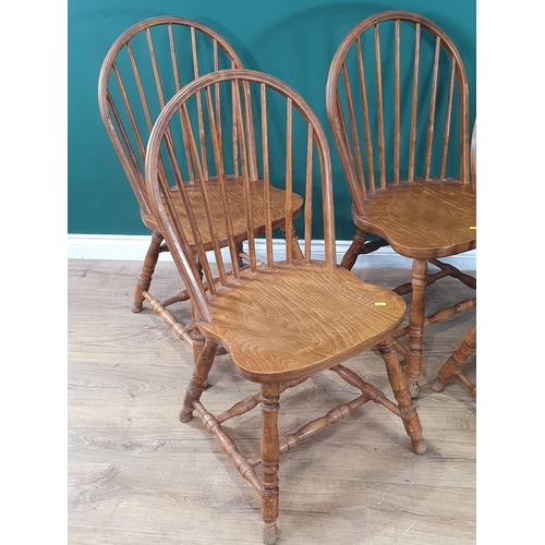 501 - A set of Four modern oak Stick back Kitchen Chairs on turned supports and stretchers. (R4).