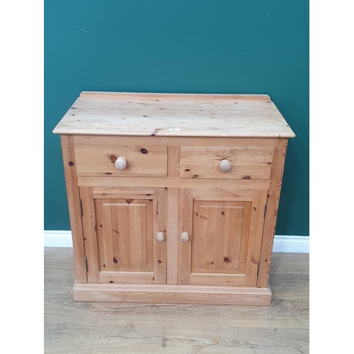 522 - A pine Cupboard fitted two frieze drawers above two doors 3ft 1in W x 2ft 11in H (R7)