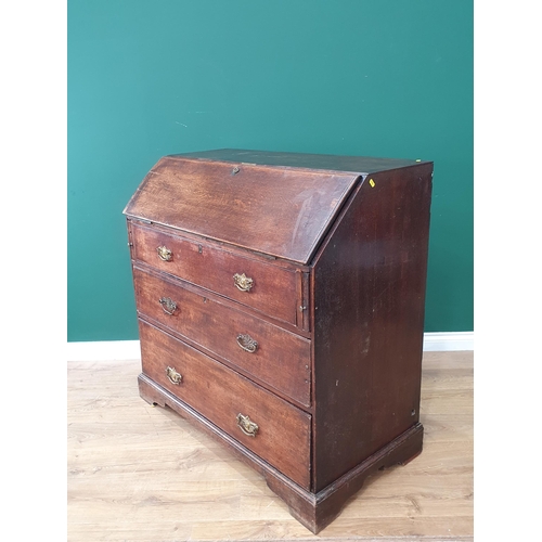 527 - A large Antique oak Bureau, the fall front enclosing pigeon hole and green felt writing surface inte... 