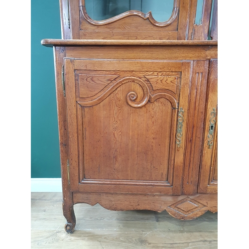 539 - An antique Continental pine Bookcase fitted pair of glazed doors above base fitted pair of fielded c... 