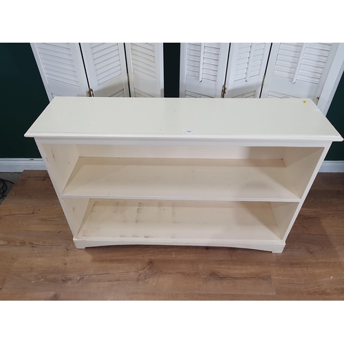 543 - A low white painted open two tier Bookcase, 2ft 7