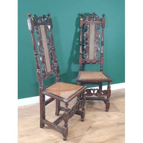 547 - A near pair of antique Carolean style High Back Side Chairs with carved scrolled designs with cane w... 