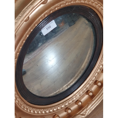 550 - A gilt framed Circular convex Wall Mirror with shaped pediment, 2ft 4