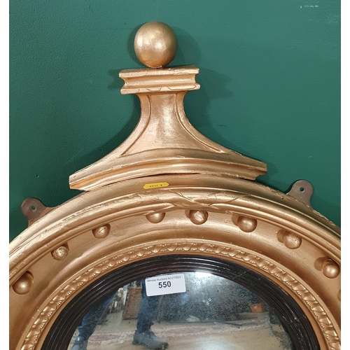 550 - A gilt framed Circular convex Wall Mirror with shaped pediment, 2ft 4