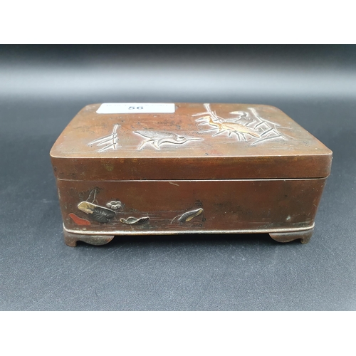 56 - An Oriental bronze oblong Box and Cover decorated storks amongst rushes, lilies on two sides, raised... 