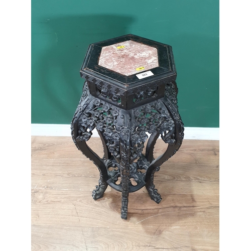 563 - A Chinese hardwood Jardinere Stand with marble inset top with carved prunus decoration 2ft 8in H x 1... 