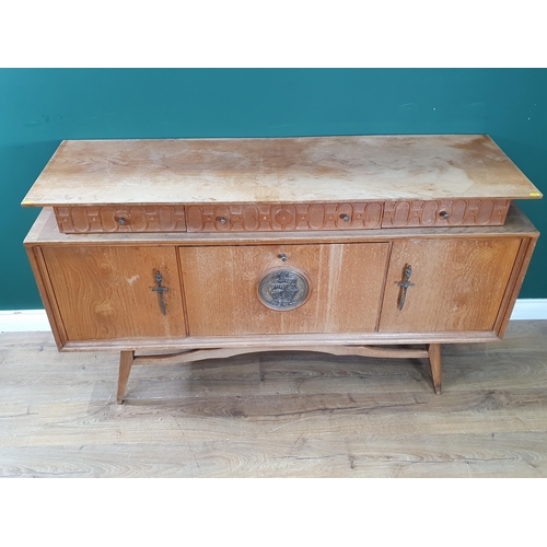 565 - A 20th Century hardwood Side Cabinet fitted three frieze drawers and two cupboard doors flanking fal... 