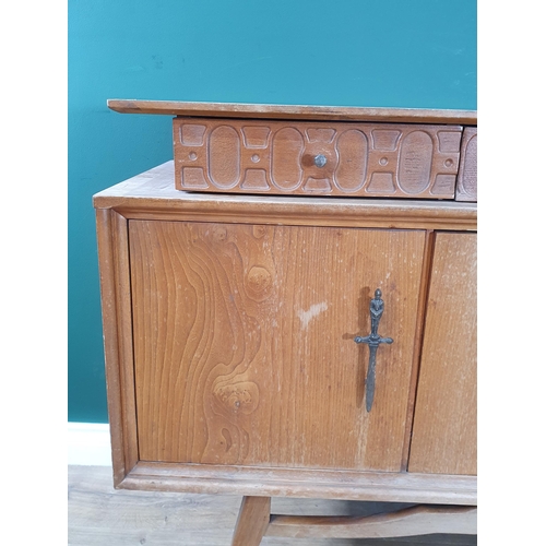 565 - A 20th Century hardwood Side Cabinet fitted three frieze drawers and two cupboard doors flanking fal... 