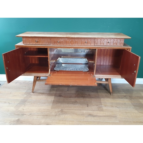 565 - A 20th Century hardwood Side Cabinet fitted three frieze drawers and two cupboard doors flanking fal... 