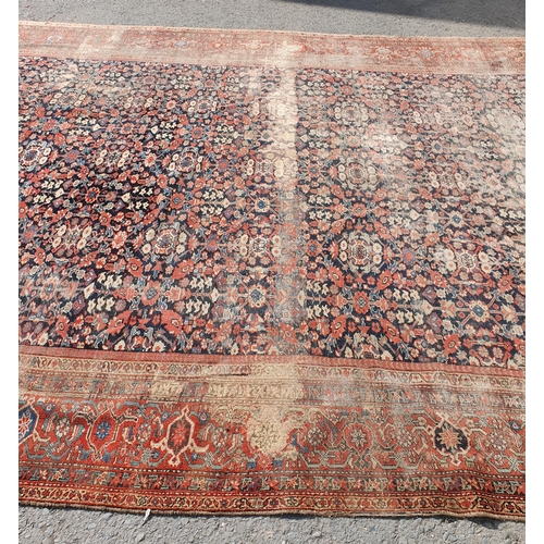 568 - A large Persian Carpet with multiple borders and design of floral motifs on a blue ground, 10ft 7in ... 