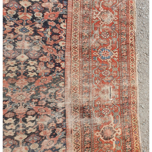 568 - A large Persian Carpet with multiple borders and design of floral motifs on a blue ground, 10ft 7in ... 