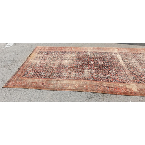 568 - A large Persian Carpet with multiple borders and design of floral motifs on a blue ground, 10ft 7in ... 