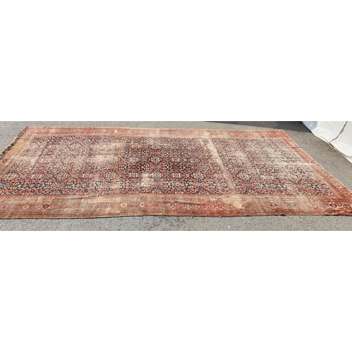 568 - A large Persian Carpet with multiple borders and design of floral motifs on a blue ground, 10ft 7in ... 