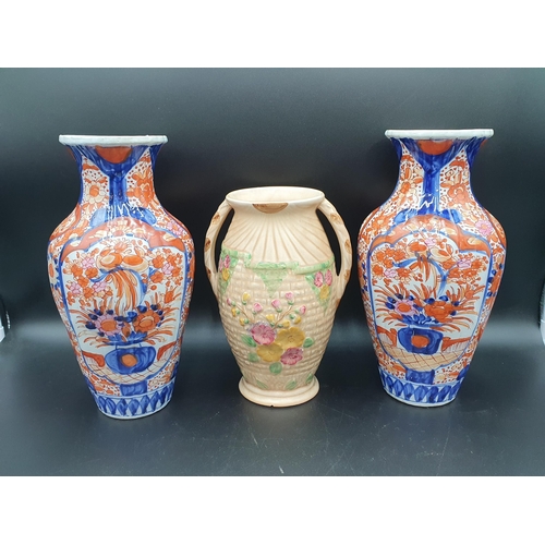 58 - A pair of Imari baluster Vases painted vases of flowers in iron red and blue, 12in, and an Arthur Wo... 