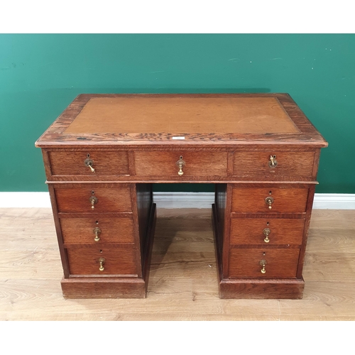 580 - An oak Pedestal Desk with brown rexine inset writing surface 3ft 6in W x 2ft 6in H (R9)