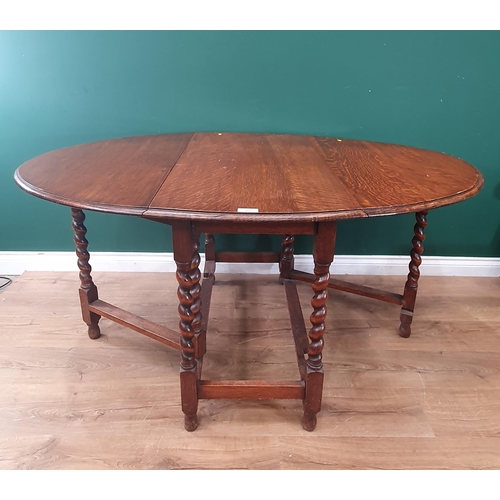 583 - An oak gateleg Dining Table on barley twist supports 3ft 3in W x 2ft 5in H (R9)