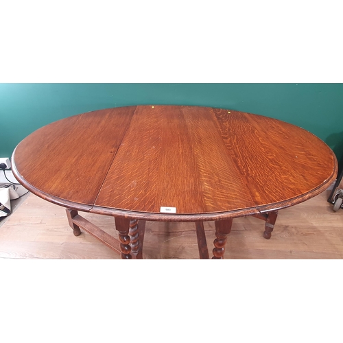 583 - An oak gateleg Dining Table on barley twist supports 3ft 3in W x 2ft 5in H (R9)