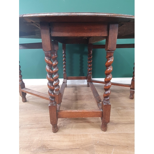 583 - An oak gateleg Dining Table on barley twist supports 3ft 3in W x 2ft 5in H (R9)