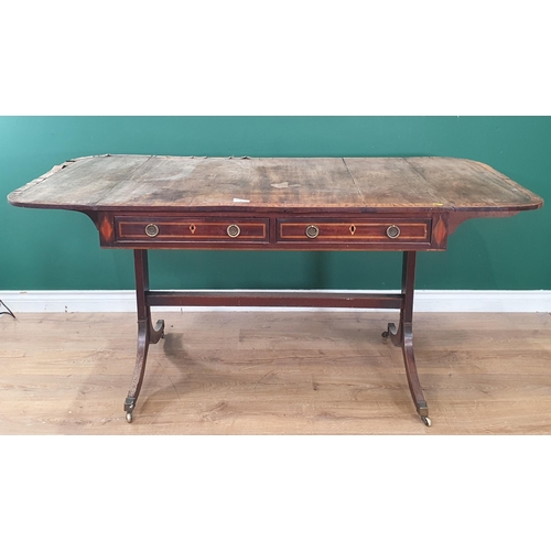 6 - A 19th Century mahogany and satinwood inlaid Sofa Table with pair of fitted drawers, raised on shape... 