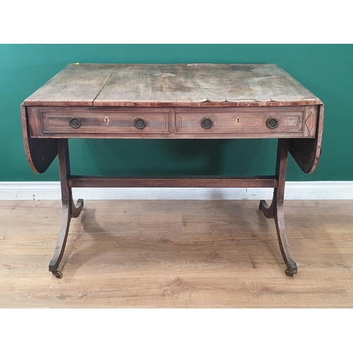 6 - A 19th Century mahogany and satinwood inlaid Sofa Table with pair of fitted drawers, raised on shape... 