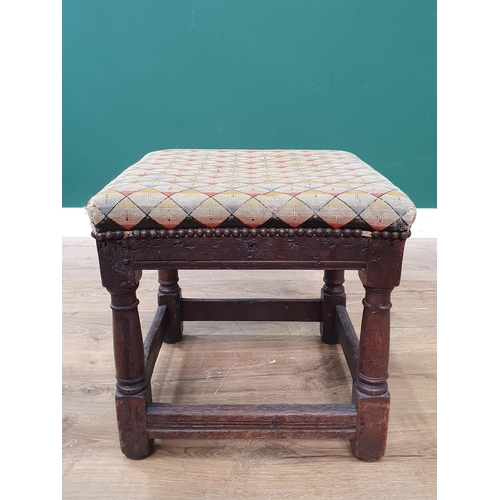 617 - A 17th Century oak Stool with upholstered top on turned supports united by surrounding stretchers 1f... 