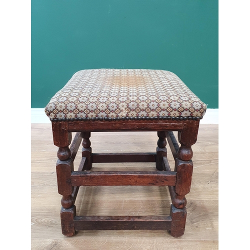 618 - An antique oak Stool with upholstered top on turned and squared supports 1ft 8in H x 1ft 4in W (R8)