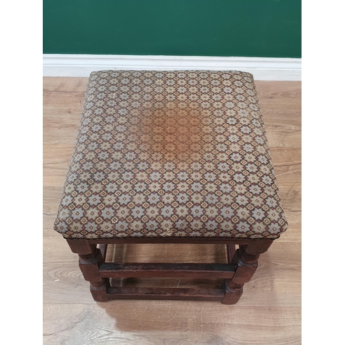 618 - An antique oak Stool with upholstered top on turned and squared supports 1ft 8in H x 1ft 4in W (R8)